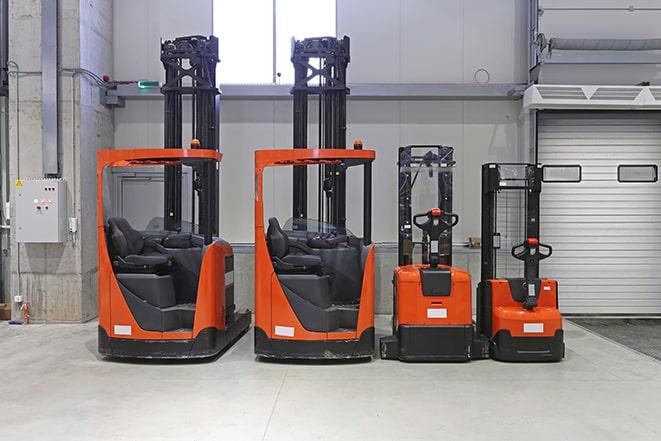 heavy-duty forklifts at work in manufacturing facility